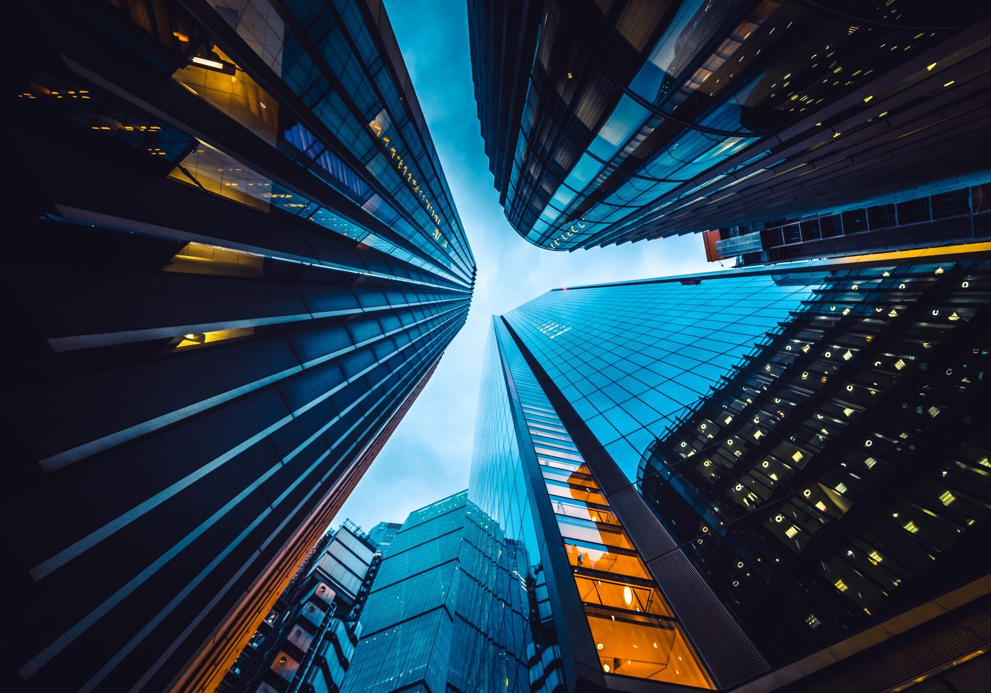 Looking directly up at the skyline of the financial district in central London